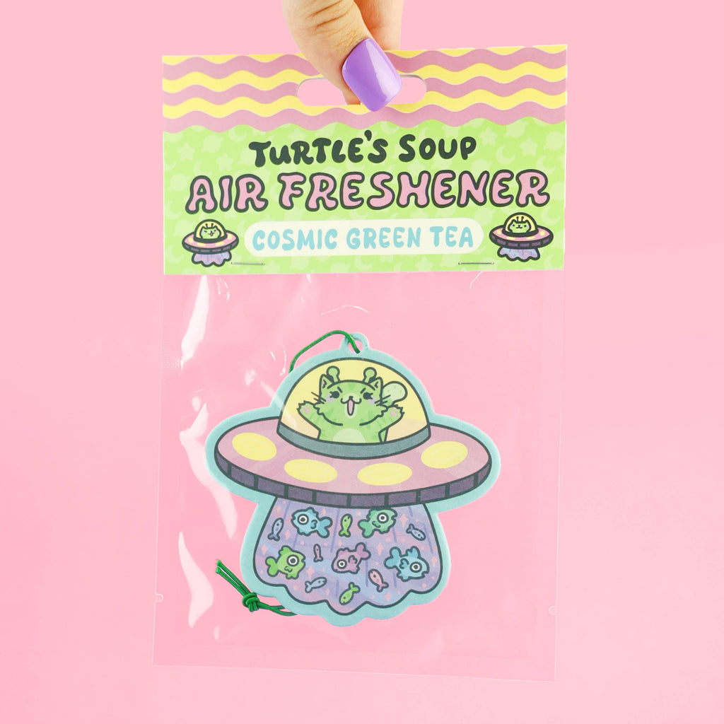 Turtle's Soup air freshener with a cartoon design on a pink background