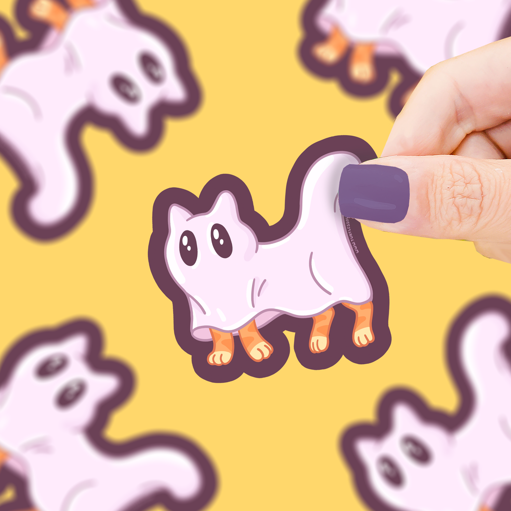 Hand holding a cute ghost sticker with a pattern of more ghost stickers in the background.