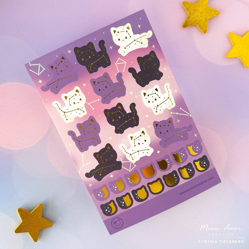 Sheet of cat-themed stickers with a purple gradient background, surrounded by gold stars.