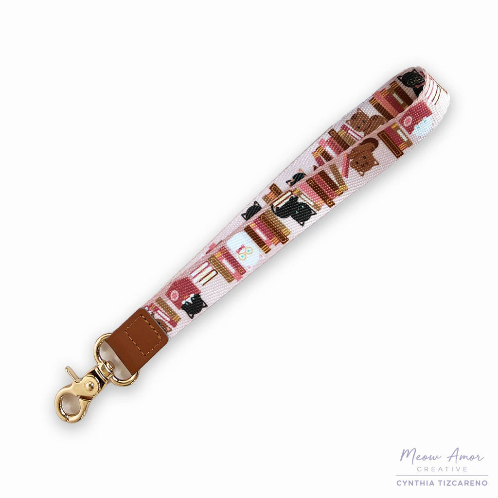 Wristlet strap with cat pattern on a white background