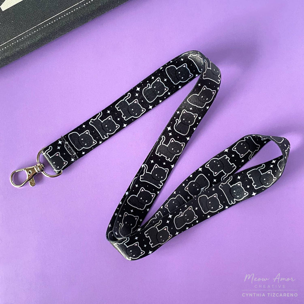 Lanyard with cat pattern on a purple background