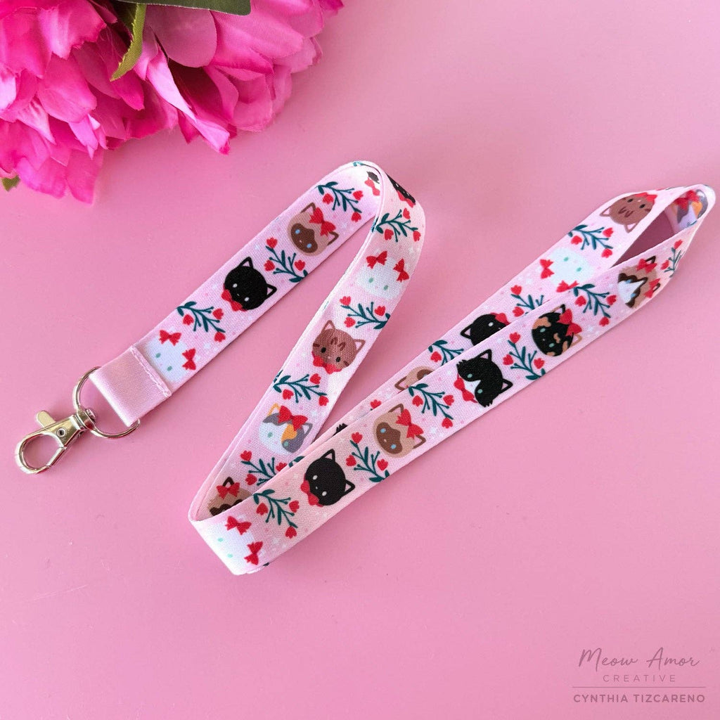Lanyard with cat and flower pattern on a pink background