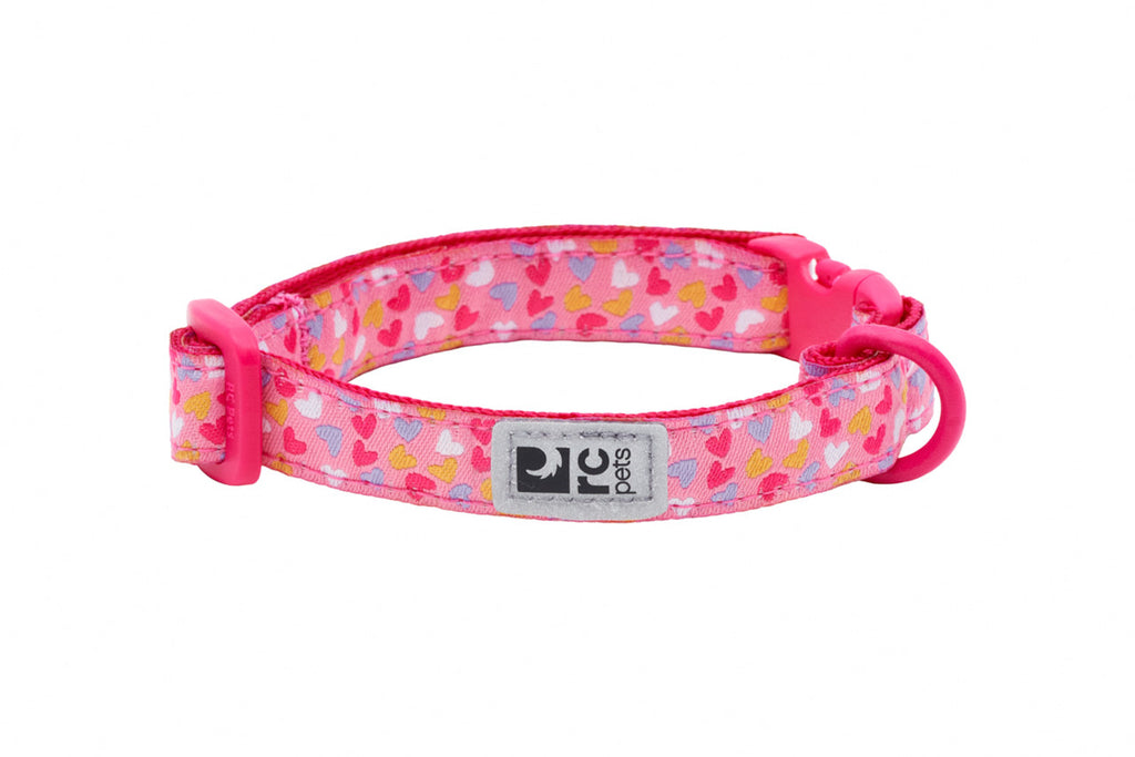 Pink cat collar with heart pattern on a white background