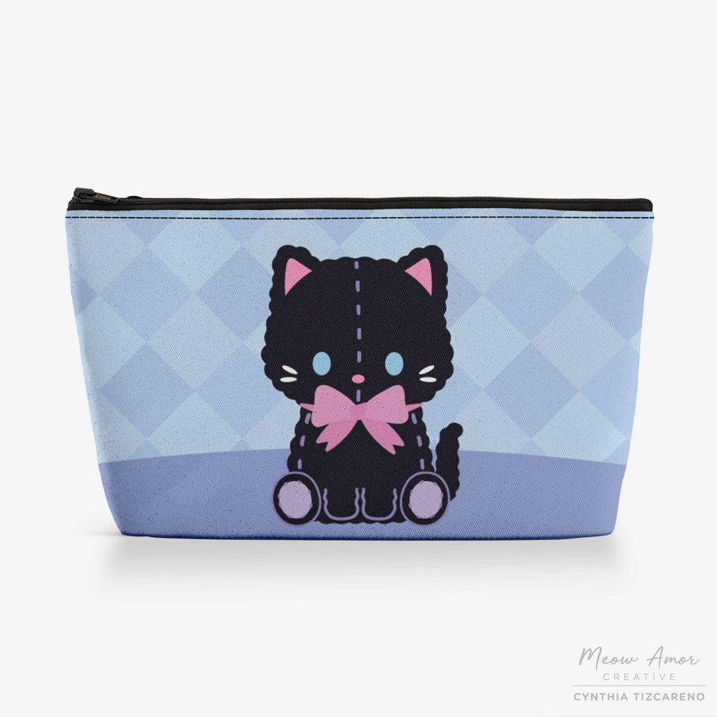 Pouch with a black cat design on a blue checkered background