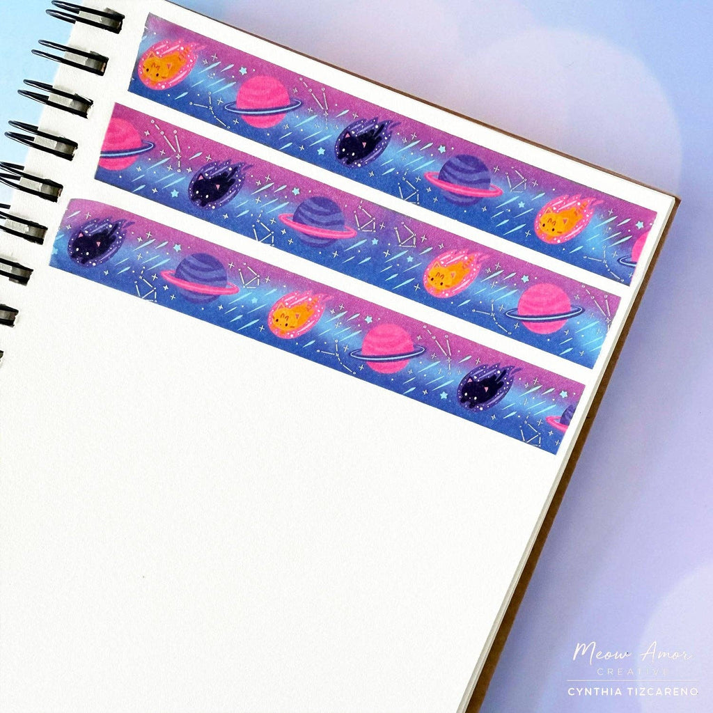 Washi tape with space-themed design on a notebook page