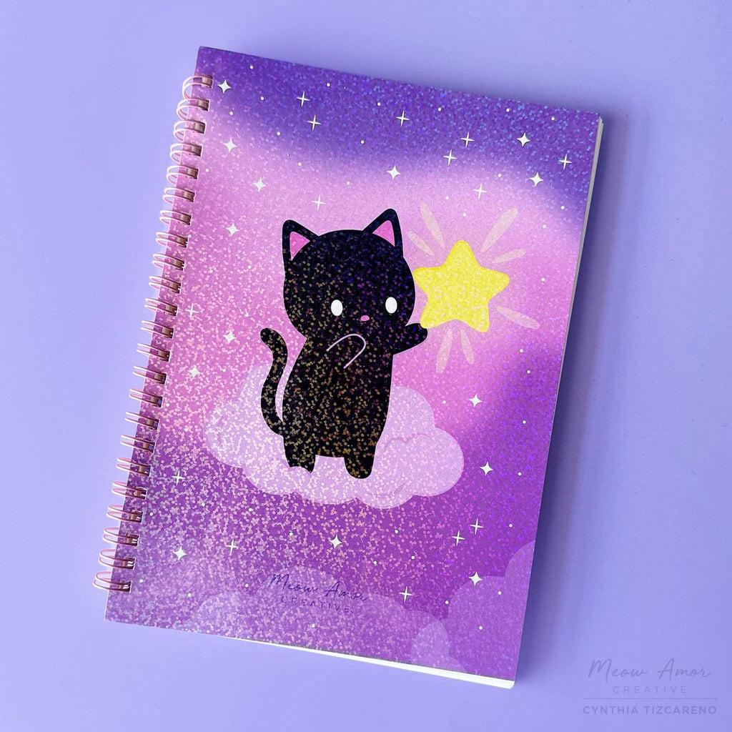 Notebook with a black cat illustration on a purple background
