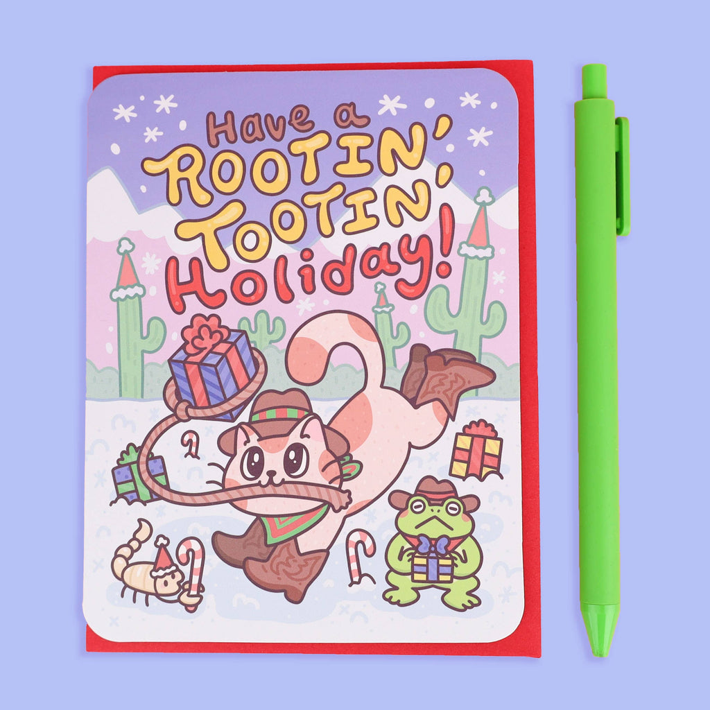 Holiday card with cartoon cat and frog, text "Have a Rootin' Tootin' Holiday!"