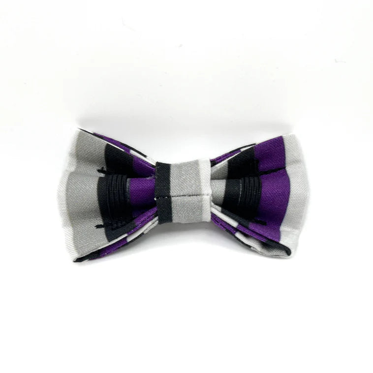 Bow tie with purple and grey striped pattern on a white background