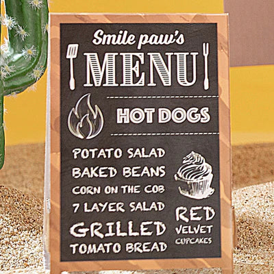 Close-up of a menu on a cardboard hot dog truck