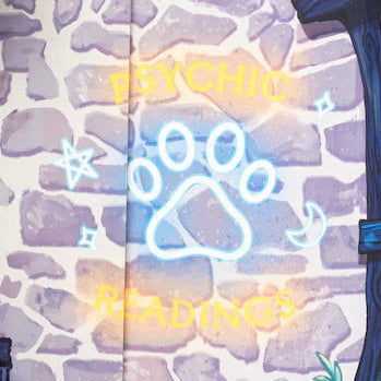 Close-up of a sign that reads "Psychic Readings"