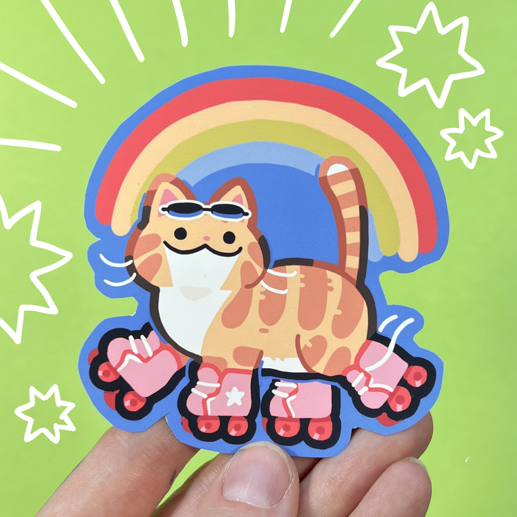 Sticker of a cat on roller skates with sunglasses held by a hand against a green background with star designs.