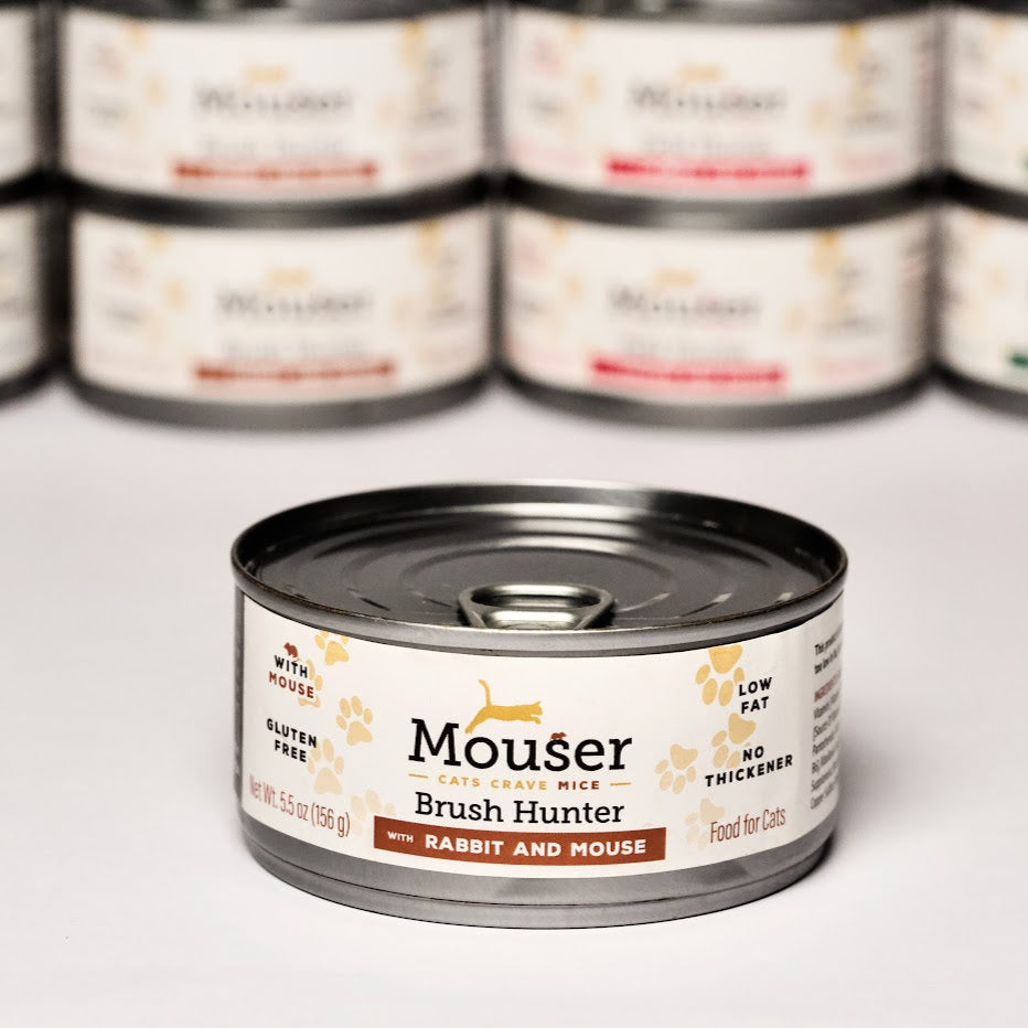Mouser canned pet food with multiple cans in the background