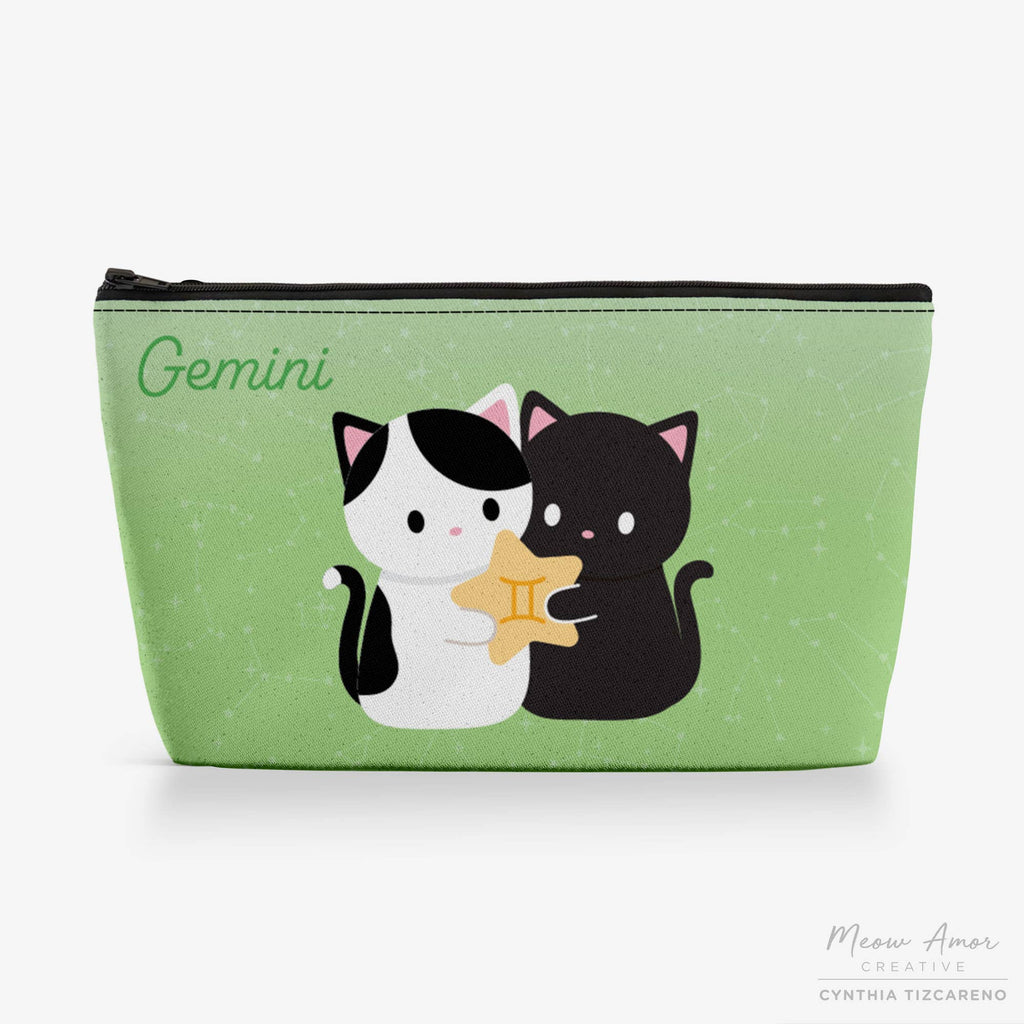 Green pouch with cartoon cats holding a star, labeled 'Gemini', on a green background.