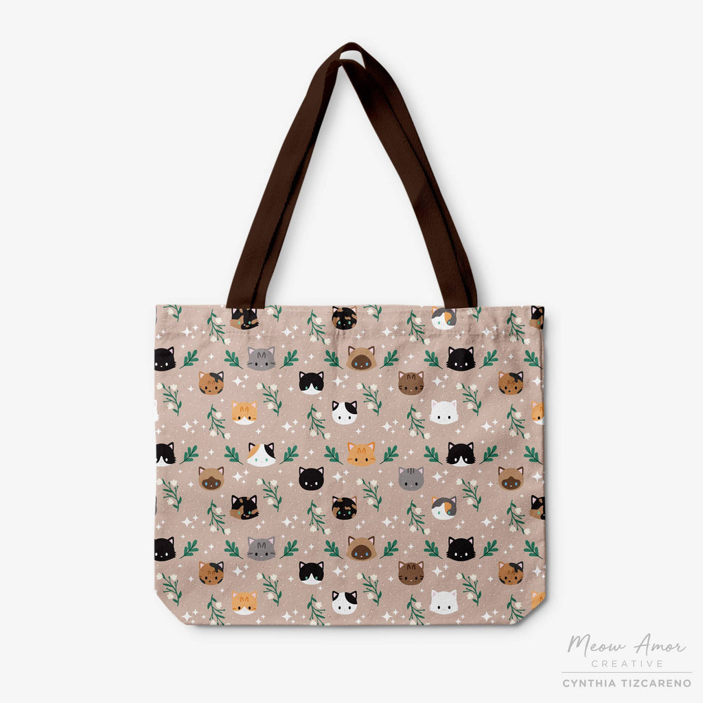 Tote bag with cat pattern and brown handles on a white background