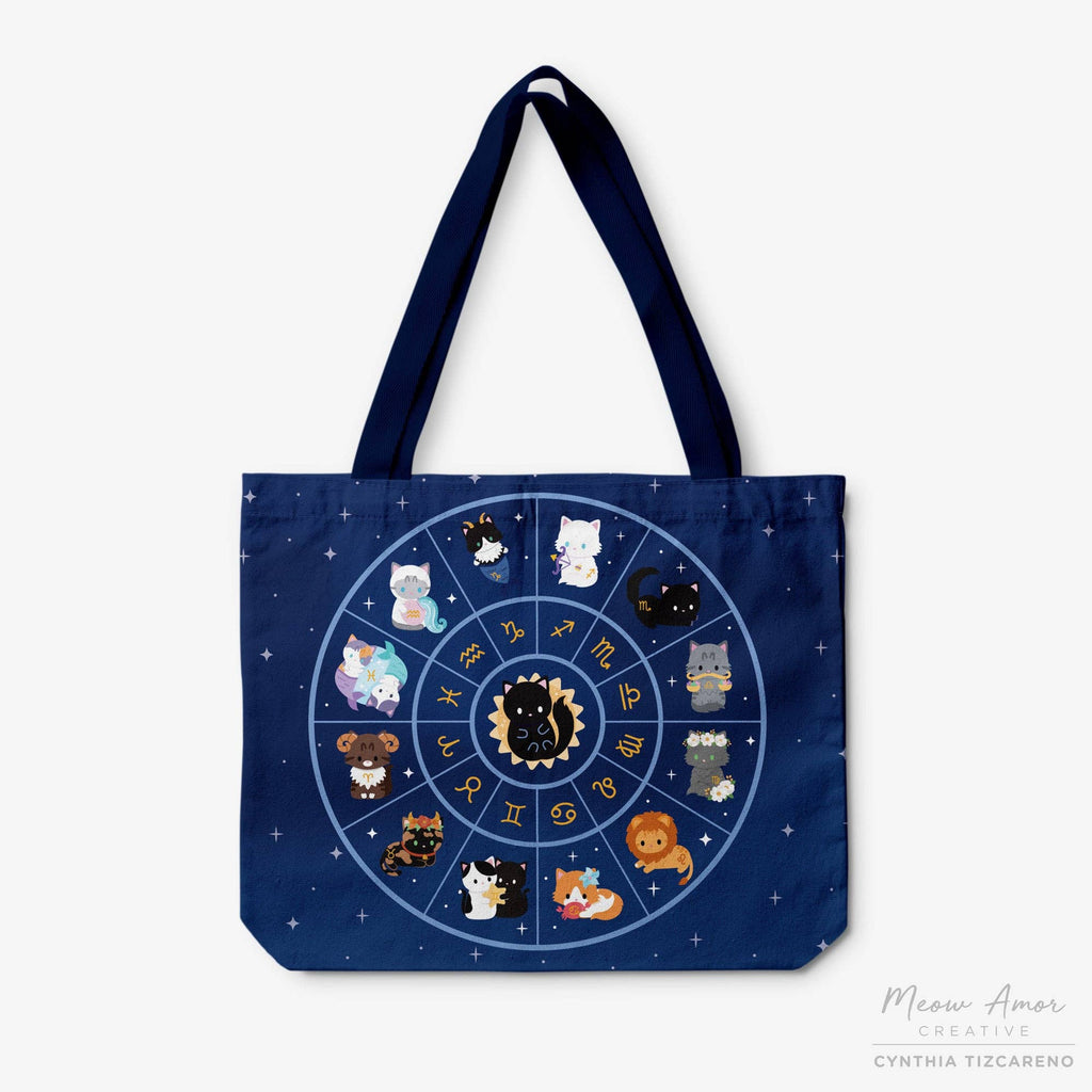 Navy tote bag with zodiac design featuring cartoon cats on a white background