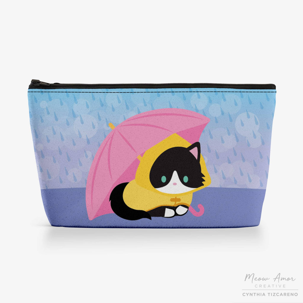 Pouch with a cat design holding an umbrella on a blue background