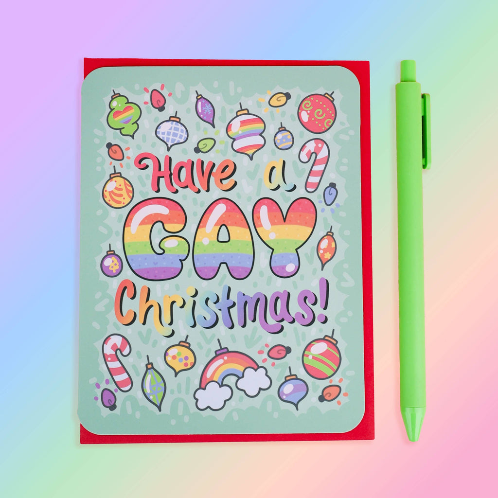 Card with 'Have a Gay Christmas!' text and festive illustrations on a colourful background