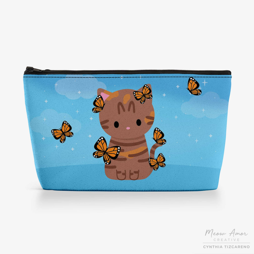 Small pouch with a cat and butterfly design on a blue background